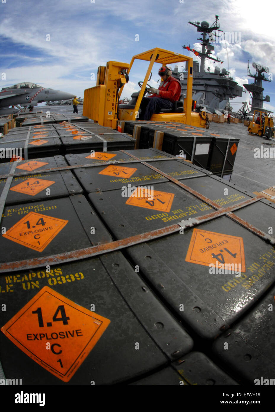 081107-N-1038M-062  PACIFIC OCEAN (Nov. 7, 2008) Aviation Ordnanceman 3rd Class Joshua Cano transports ammunition on the flight deck aboard the aircraft carrier USS George Washington (CVN 73) during a weapons transfer with the Military Sealift Command ammunition ship USNS Shasta (T-AE 33). The permanently forward deployed George Washington Carrier Strike Group is conducting training operations in the Pacific Ocean to heighten operational readiness. (U.S. Navy photo by Mass Communication Specialist Seaman Anthony R. Martinez/Released) US Navy 081107-N-1038M-062 Aviation Ordnanceman 3rd Class Jo Stock Photo