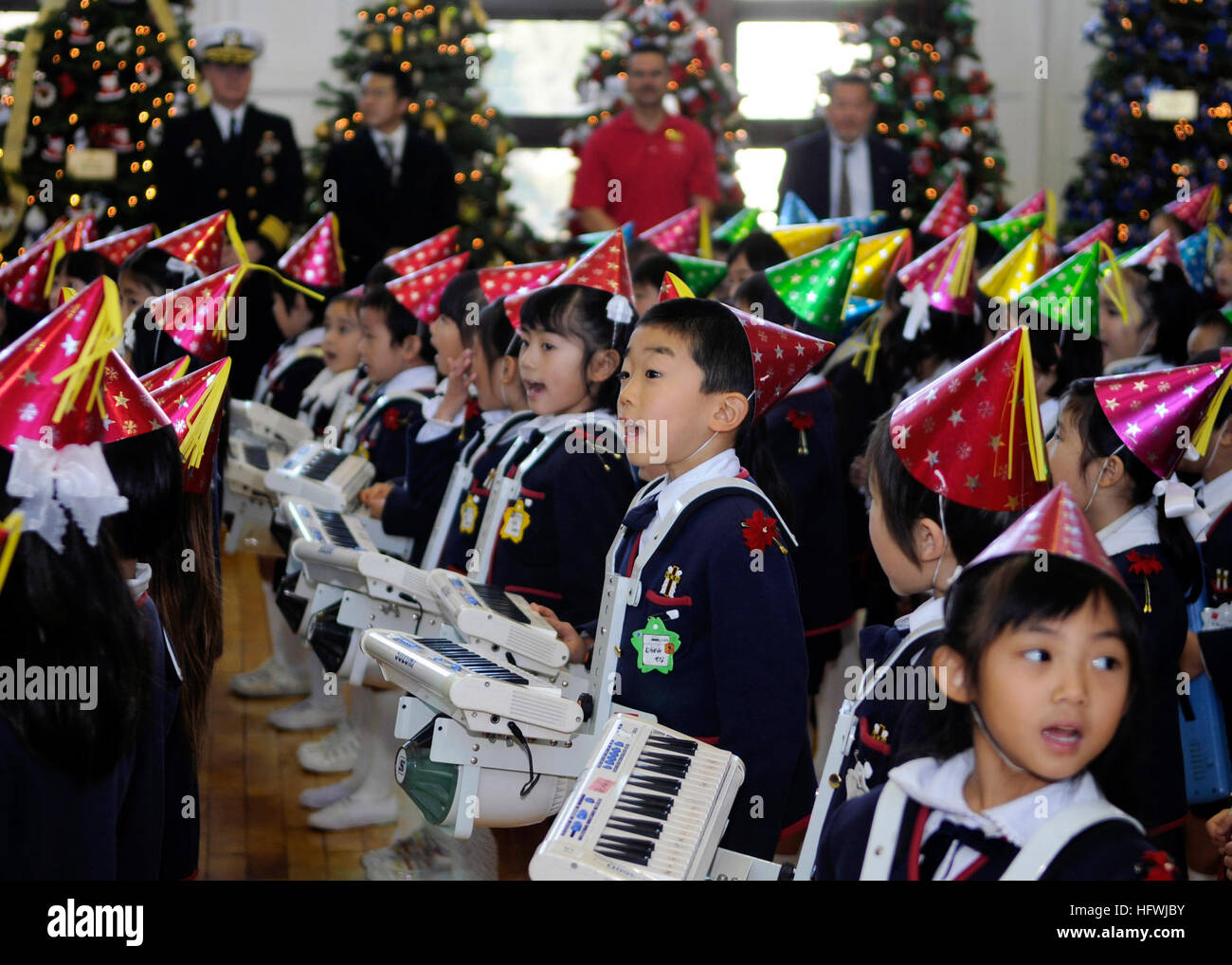 081206-N-8534H-010  YOKOSUKA, Japan (Dec. 6, 2008)  Children from Seika Kindergarten sing traditional Christmas songs during Fleet Activities Yokosuka's (CFAY) Grand Illumination open base event. Yokosuka opened its gates to more than 80,000 Japanese visitors who enjoyed tours of the aircraft carrier USS George Washington (CVN 73), holiday lights and decorations, a festival of Christmas trees and American fare. Open-base events like this help strengthen neighborly bonds and encourage friendship between Japanese citizens and the U.S. Navy community. (U.S. Navy photo by Mass Communication Specia Stock Photo