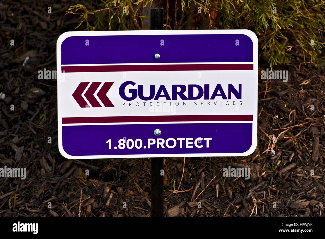 A Guardian protection sign displayed in the front of a residential home