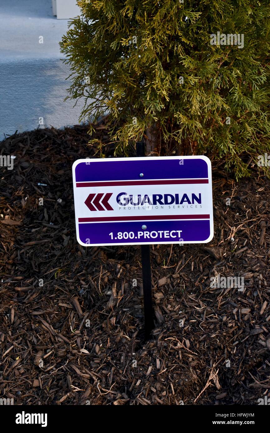 A Guardian protection sign displayed in the front of a residential home