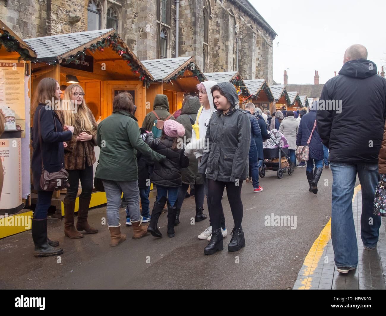 Shoppers browse the Christmas market in Winchester, Hampshire, England Stock Photo