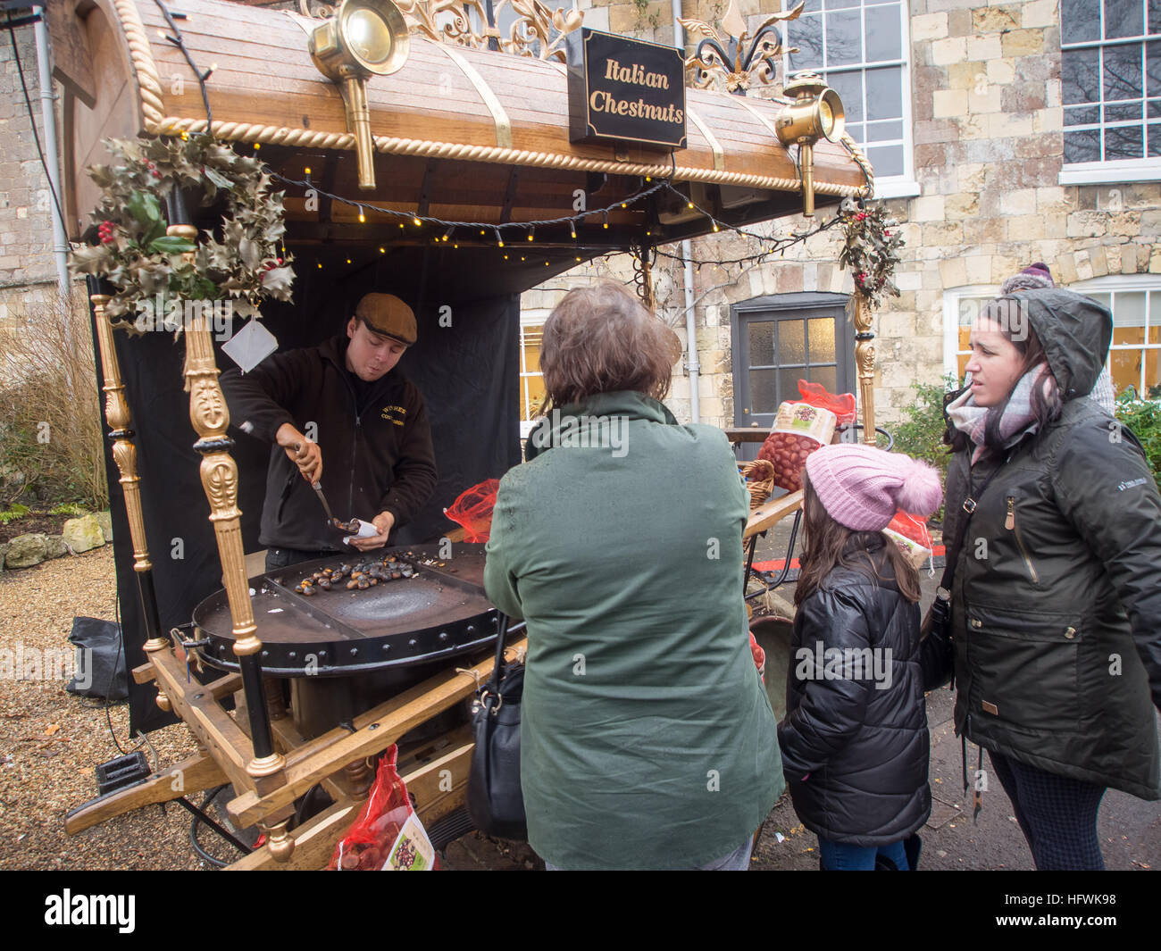 A traditional roasted chestnut stall at a winter market. Stock Photo