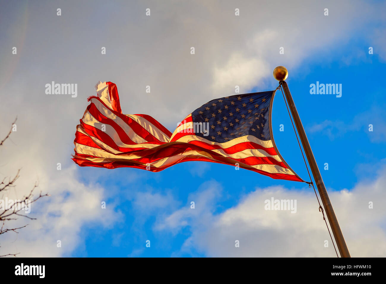 Waving American flag against a blue sky background. US flag sky Stock ...