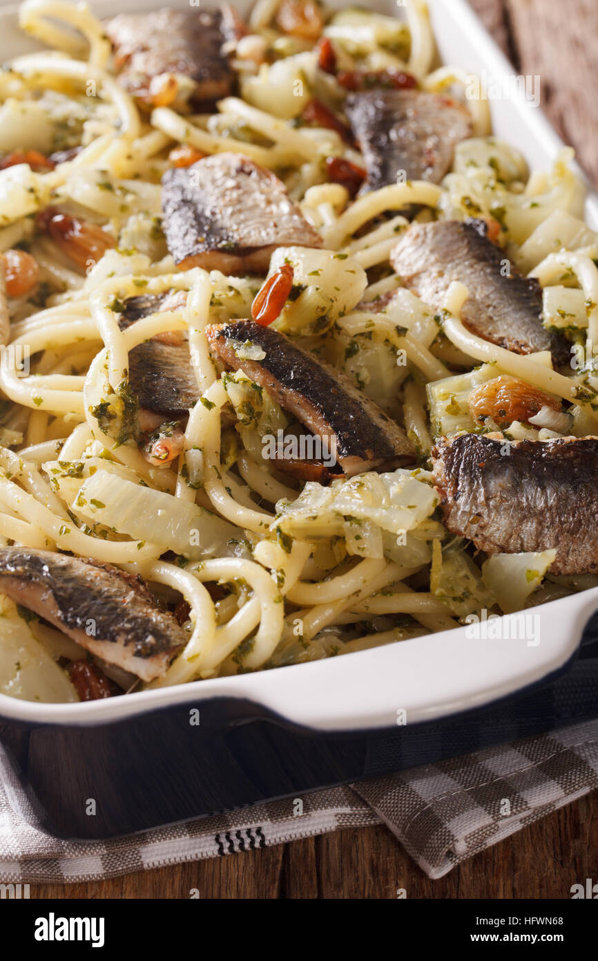 Italian pasta with sardines, fennel, raisins and pine nuts macro in a