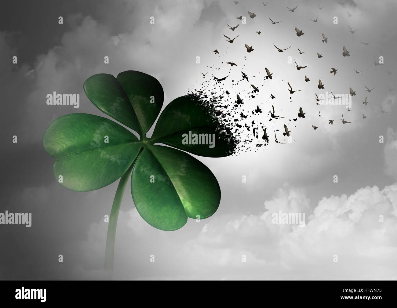 Losing luck or spreading good fortune concept as a four leaf clover transforming into flying birds as a surreal communication metaphor for financial a Stock Photo