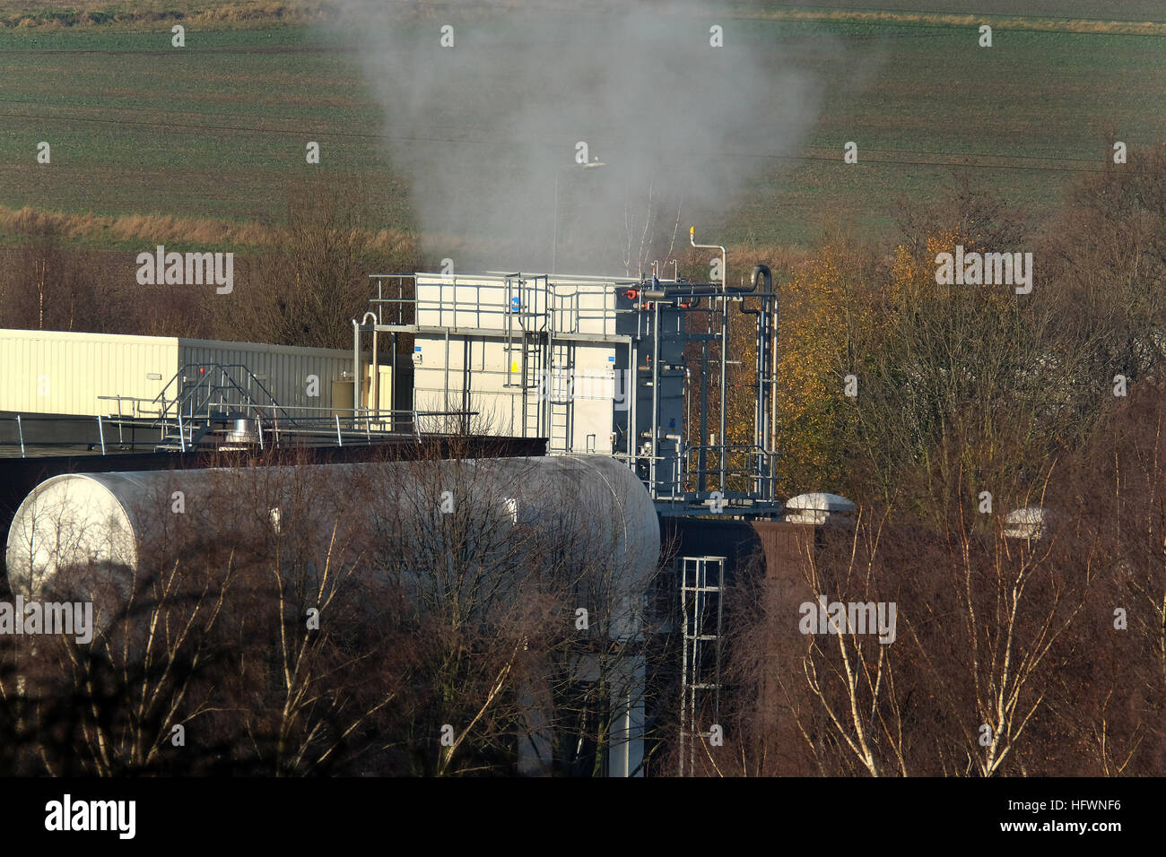 Steam effluent from food processing factory in town suburbs. Stock Photo