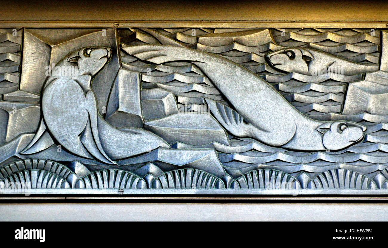 London, England, UK. Former Derry and Toms Dept Store, Kensington High Street (Art Deco, 1933 - arch: Bernard George) Art Deco facade detail - seals / Stock Photo