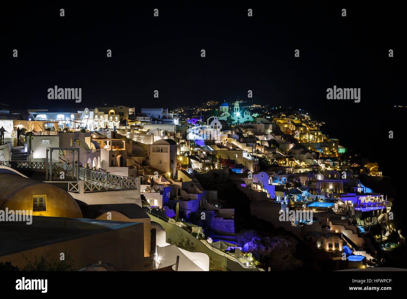 Panoramic nighttime view of Oia, Santorini, a Mediterranean Greek ...