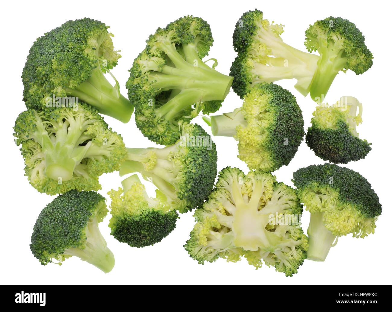 Twelve pieces of fresh green broccoli cabbage  lie on a table of the cook. Isolated top view image Stock Photo