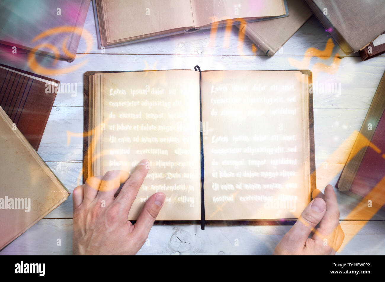 Old book with empty pages for your text and man's hand shows important place. Stock Photo
