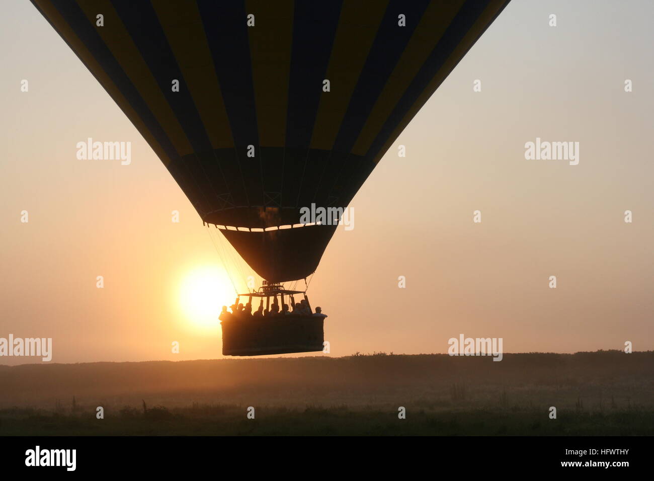 Balloon ride at sunrise Stock Photo - Alamy