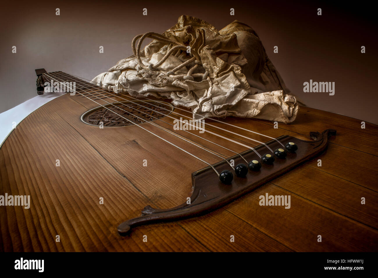 Oud Guitar Lute and white rustic baroque shirt In shape and posture of player Stock Photo