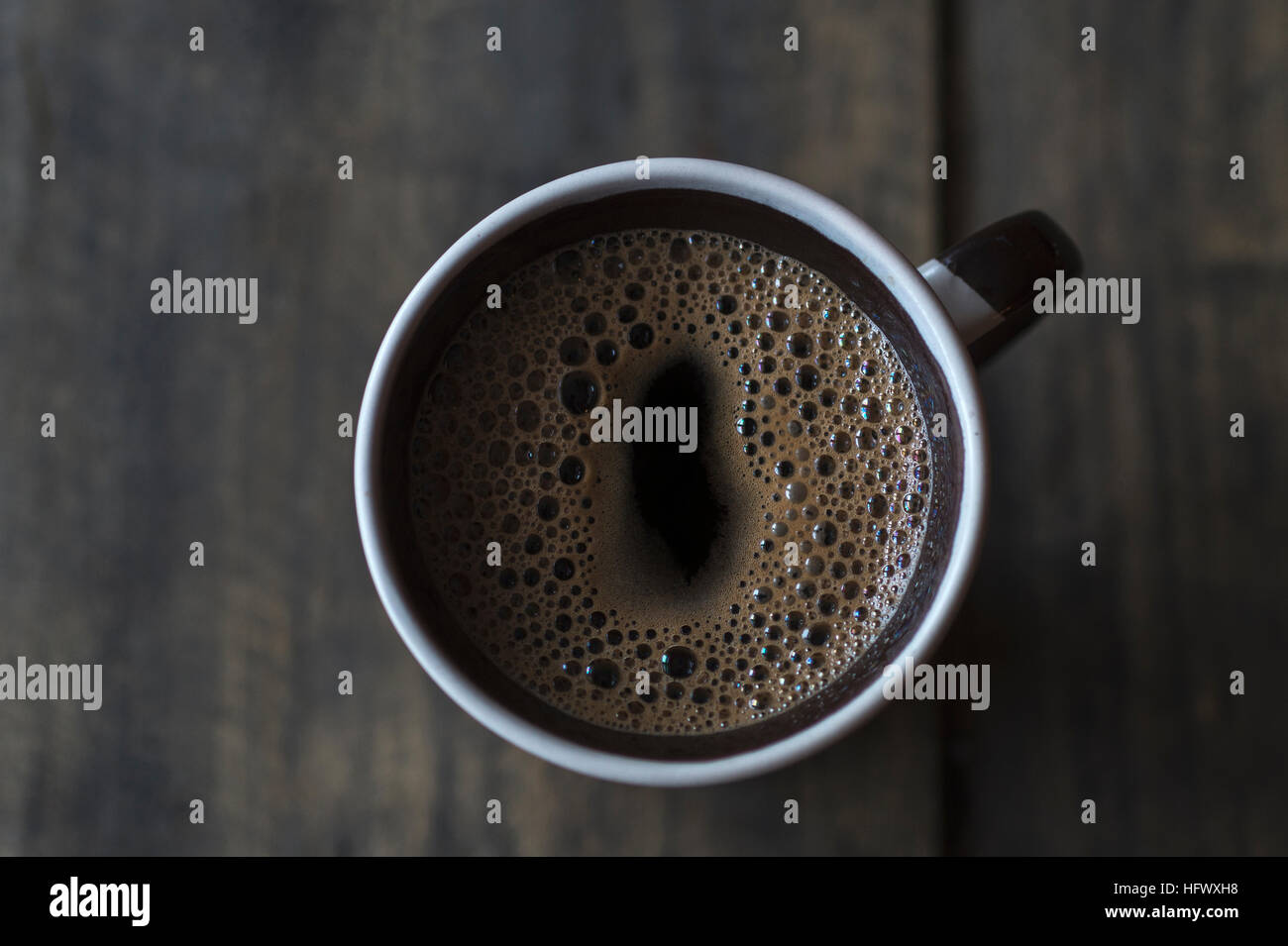 Cup of Coffee on Wooden Table, from above Stock Photo