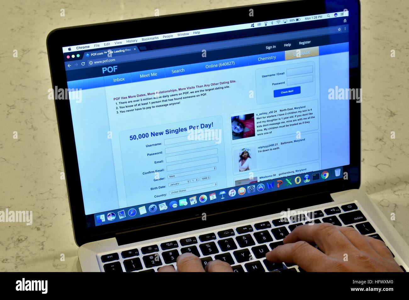 An Apple Macbook Pro displaying the Plenty of Fish dating website Stock Photo