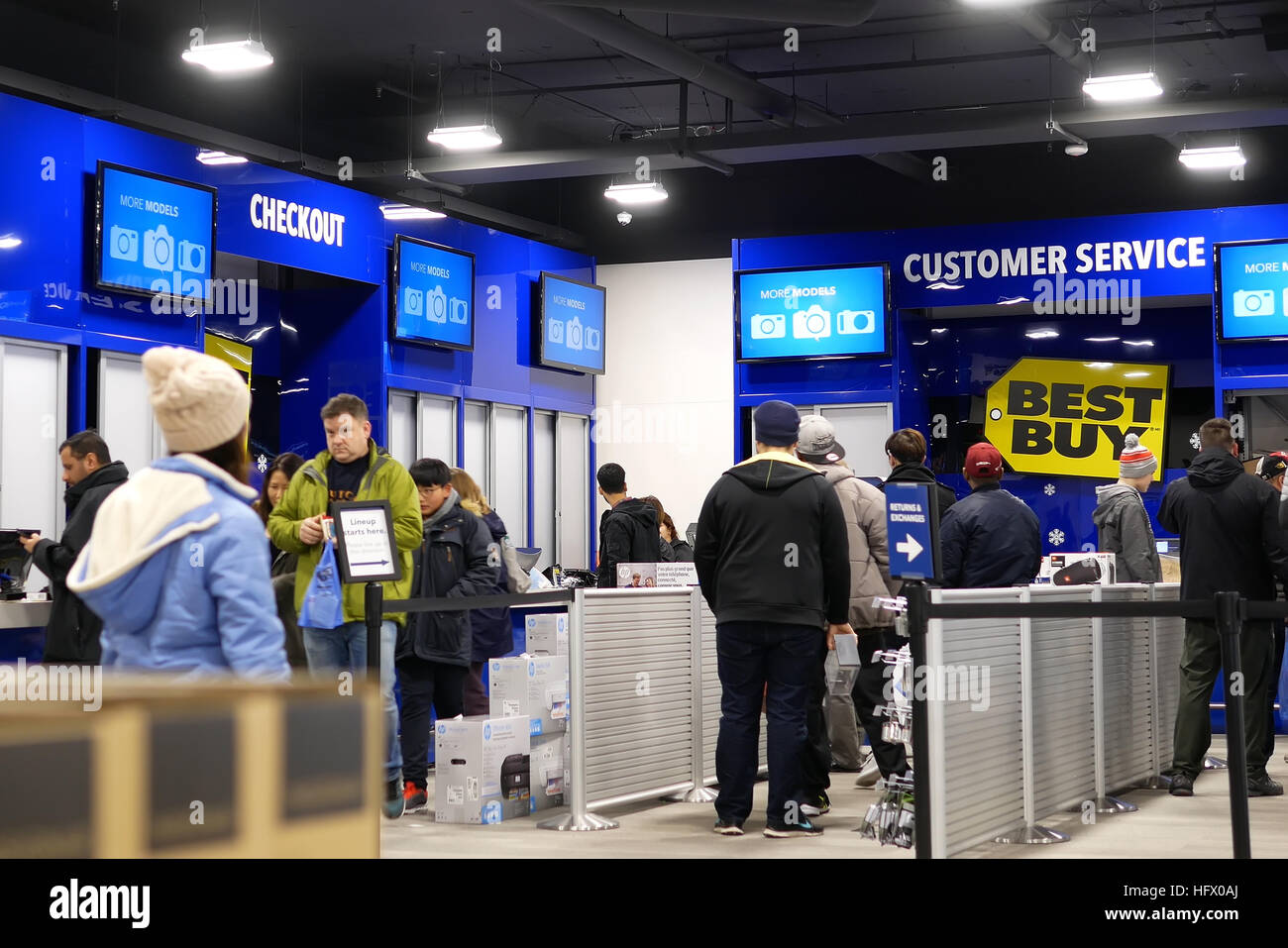 Coquitlam, BC, Canada - December 30, 2016 : Motion of people line up for buying gift inside Best buy store Stock Photo