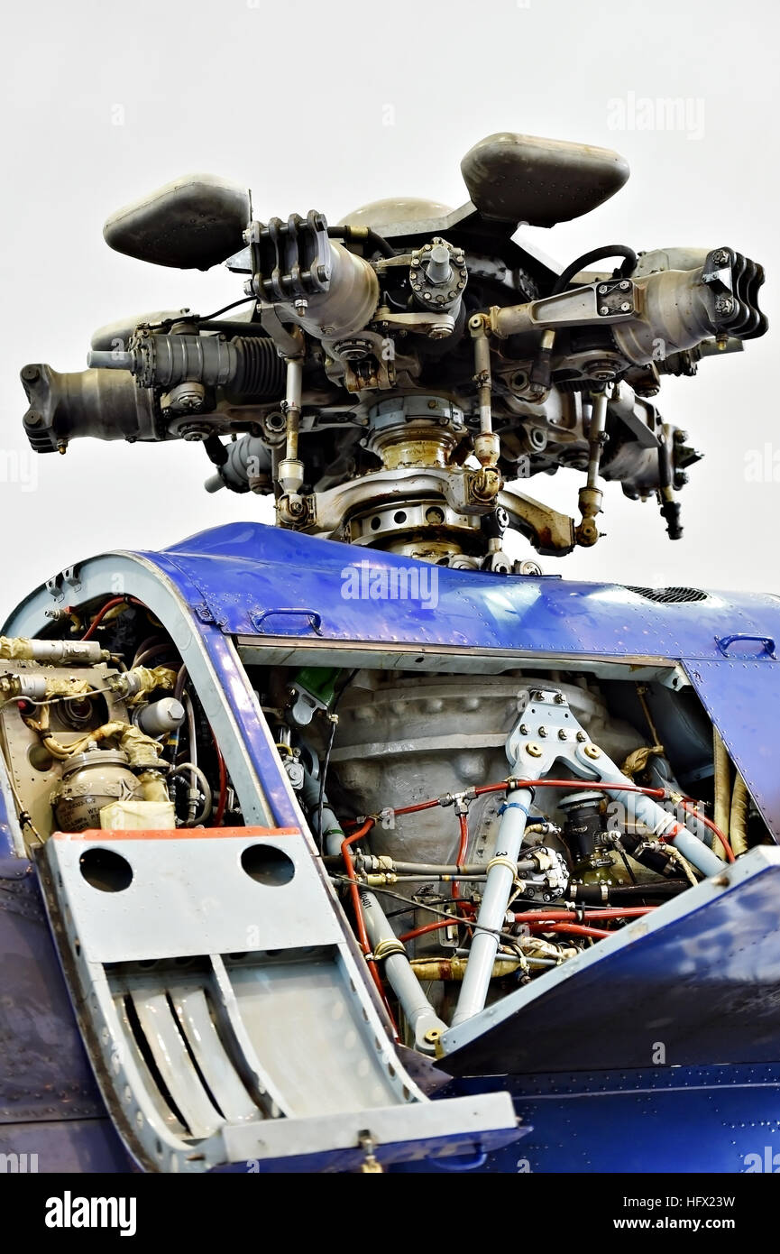 Detail with helicopter fuselage and rotor blade system on repair line