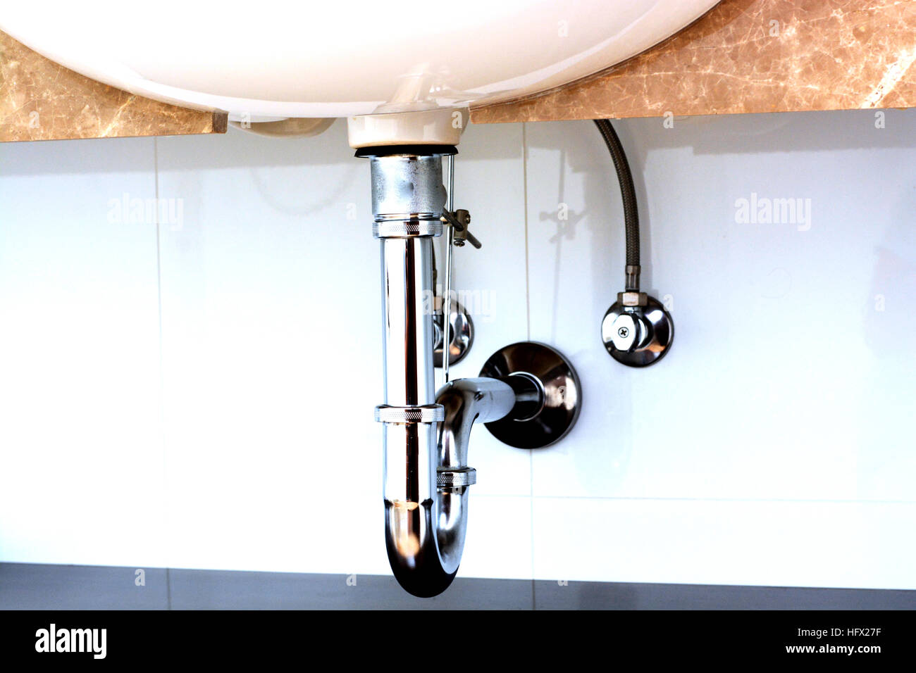 Basin siphon or sink drain in a bathroom Stock Photo
