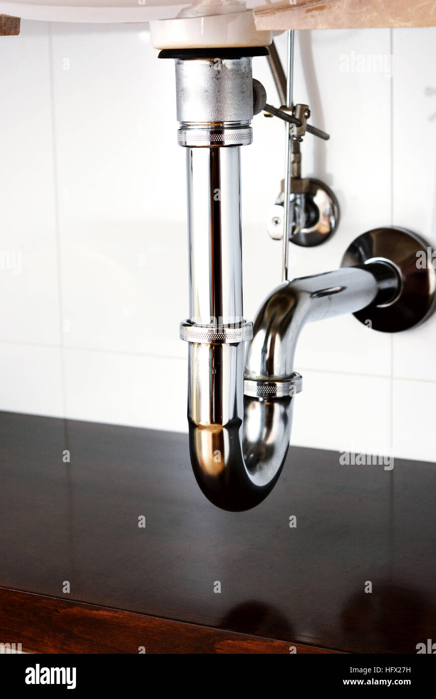 Basin siphon or sink drain in a bathroom Stock Photo