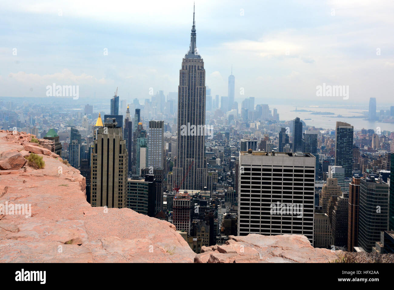 Above Manhattan, Empire State Building and downtown aerial view from a rock cliff Stock Photo