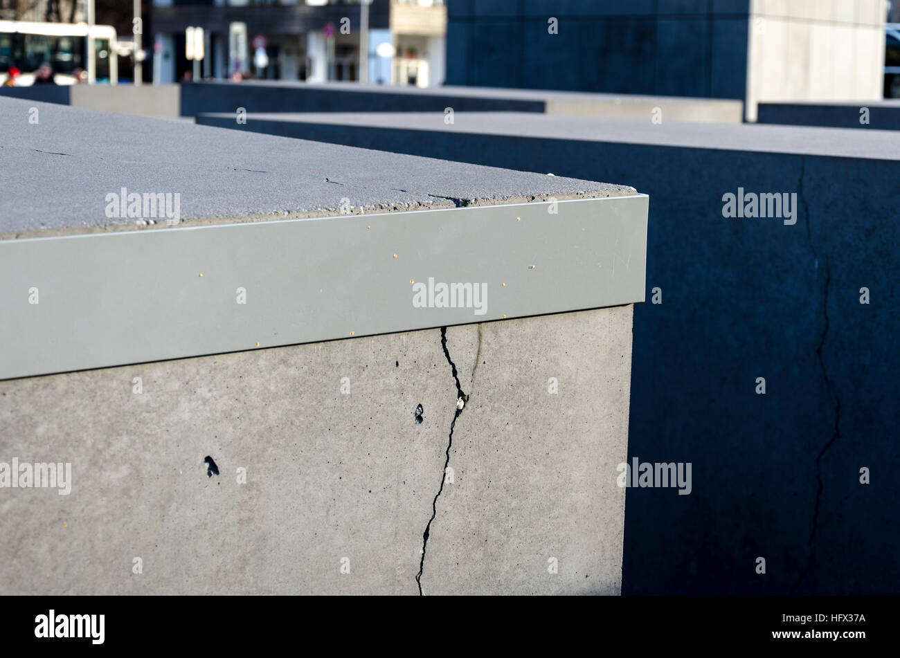 Cracks in the concrete blocks held by metal bands on Memorial to the Murdered Jews of Europe. Berlin, Germany Stock Photo