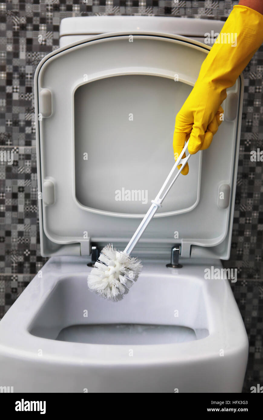 cleaning of white toilet bowl in yellow rubber gloves Stock Photo Alamy