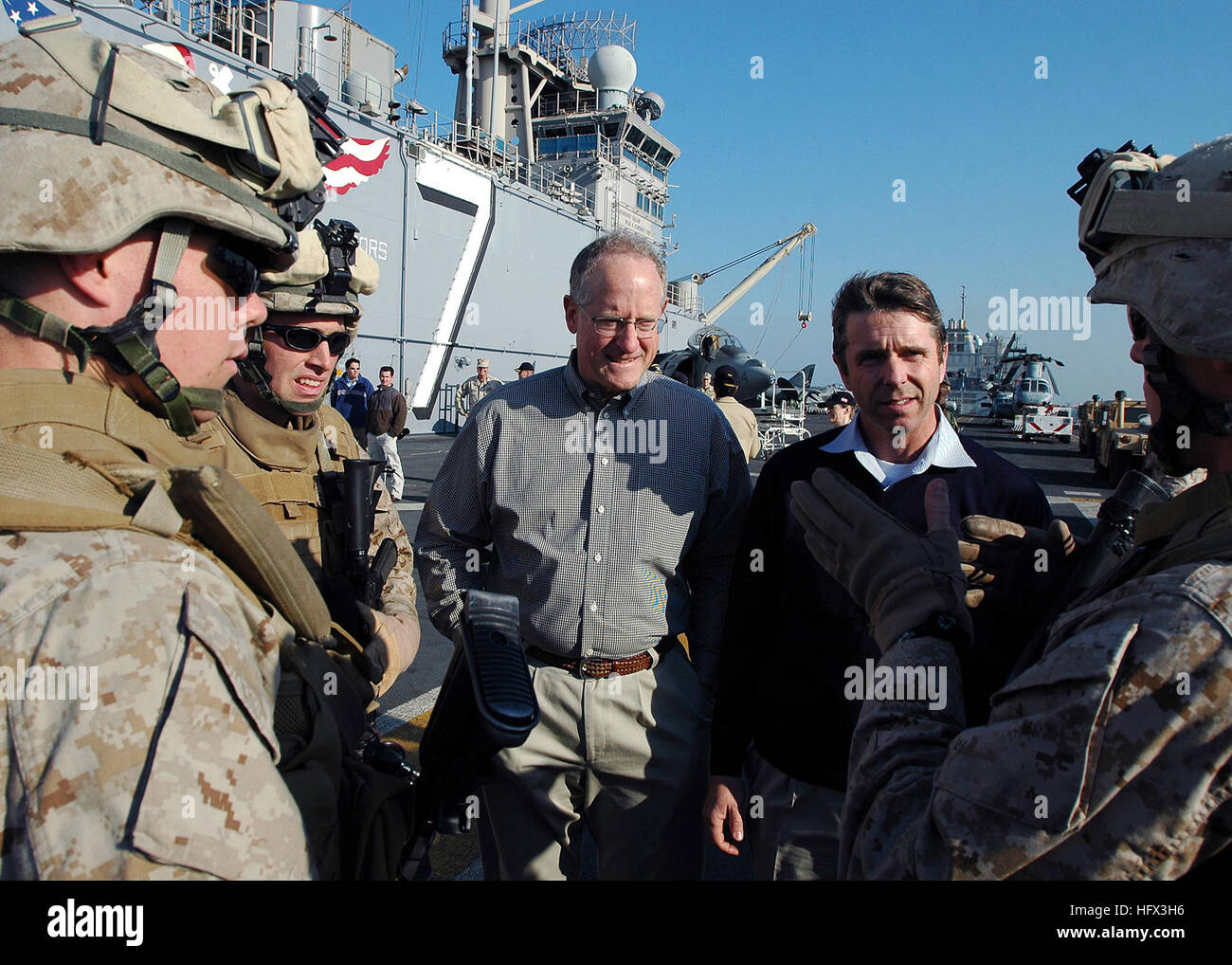 081219-N-5681S-066 BAHRAIN (Dec. 19, 2008) U.S. Reps. Mike Conaway, left, and Rob Whitman speak with Marines on the flight deck of the multi-purpose amphibious assault ship USS Iwo Jima (LHD 7). Iwo Jima is deployed the lead ship of the Iwo Jima Expeditionary Strike Group supporting maritime security operations in the U.S. 5th Fleet area of responsibility. (U.S. Navy photo by Mass Communication Specialist 2nd Class Michael Starkey/Released) US Navy 081219-N-5681S-066 U.S. Reps. Mike Conaway, left, and Rob Whitman speak with Marines on the flight deck of the multi-purpose amphibious assault shi Stock Photo