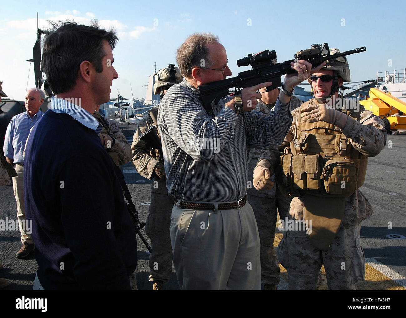 081219-N-5681S-074 BAHRAIN (Dec. 19, 2008) Marines demonstrate weapons to U.S. Reps. Rob Whitman, left, and Mike Conaway aboard the multi-purpose amphibious assault ship USS Iwo Jima (LHD 7). The congressmen are aboard the ship as part of a congressional delegation. U.S. Navy photo by Mass Communication Specialist 2nd Class Michael Starkey (Released) US Navy 081219-N-5681S-074 Marines demonstrate weapons to U.S. Reps. Rob Whitman, left, and Mike Conaway aboard the multi-purpose amphibious assault ship USS Iwo Jima (LHD 7) Stock Photo