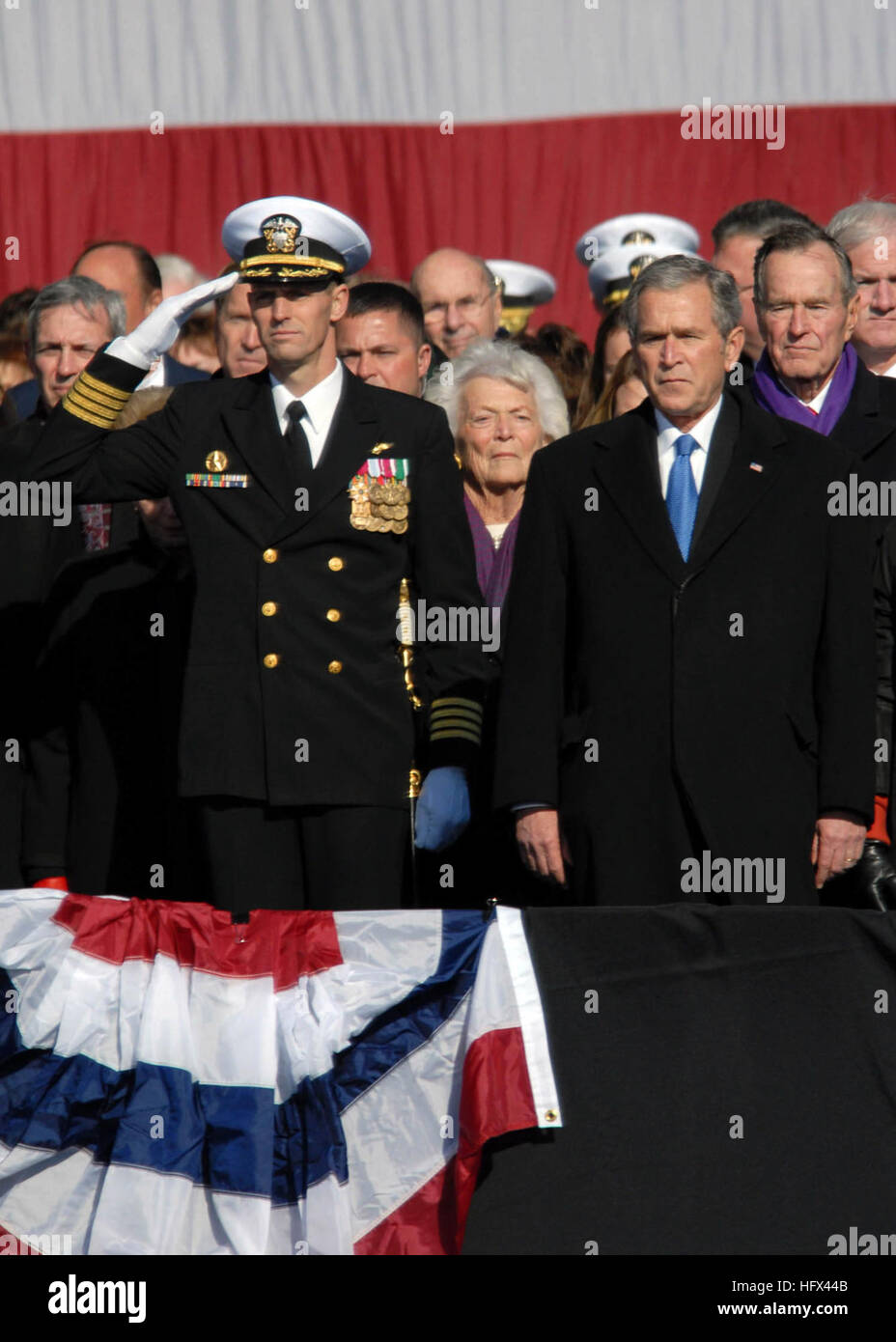 090110-N-4408B-156 NORFOLK (Jan. 10, 2009) Capt. Kevin E. O'Flaherty, left, commanding officer of the aircraft carrier USS George H.W. Bush (CVN 77), stands next to President George W. Bush during a 21-gun salute during the commissioning ceremony of the aircraft carrier USS George H.W. Bush (CVN 77) at Naval Station Norfolk, Va. The Navy's newest, and final, Nimitz-class aircraft carrier is named after World War II naval aviator and the 41st president of the United States George H.W. Bush. (U.S. Navy photo by Mass Communication Specialist 3rd Class Micah P. Blechner/Released) US Navy 090110-N- Stock Photo