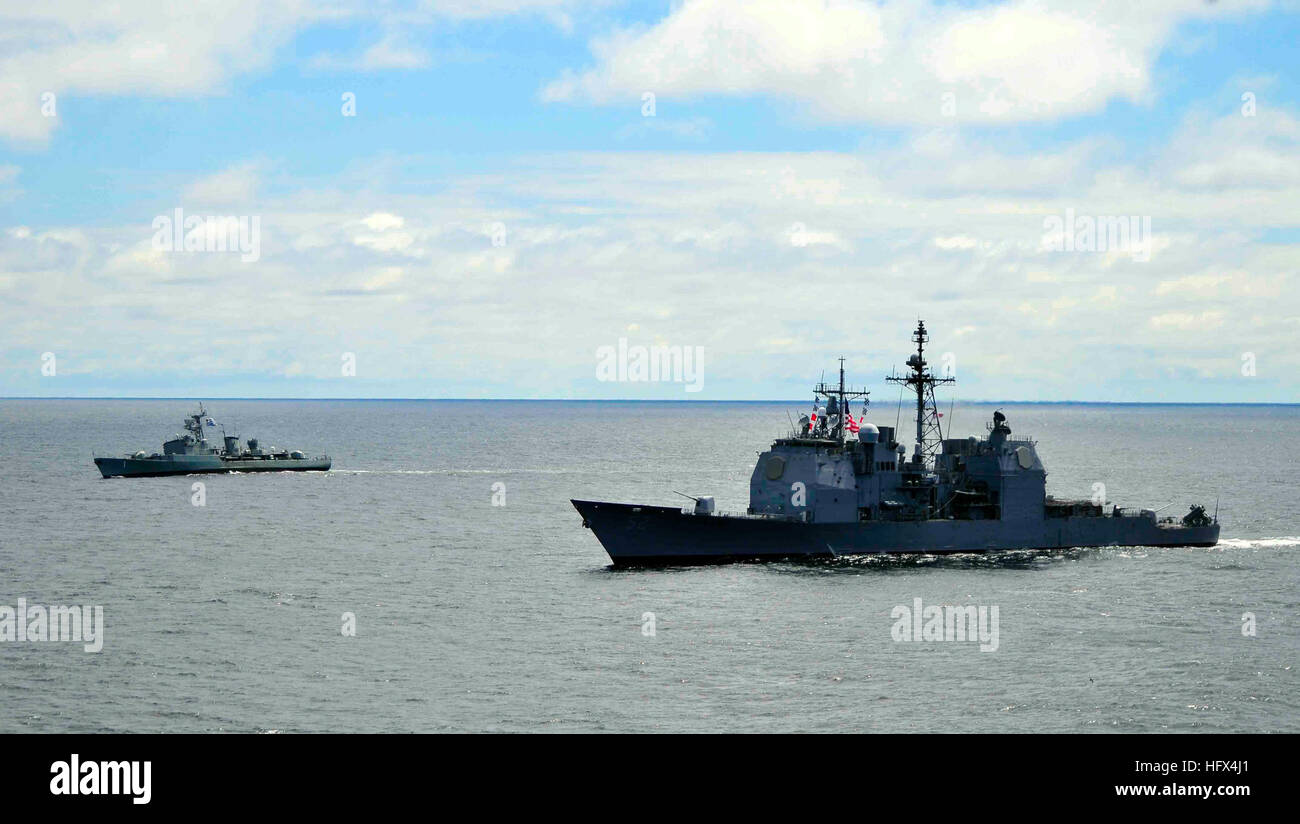 The guided-missile cruiser USS Bunker Hill and the Uruguayan navy frigate Uruguay perform tactical maneuvers in the Atlantic Ocean. Bunker Hill and Uruguay are participating in Southern Seas 2010, a U.S. Southern Command-directed operation that provides U.S. and international forces the opportunity to operate in a multi-national environment. (U.S. Navy photo by Seaman Megan L. Catellier) USS Bunker Hill DVIDS258119 Stock Photo