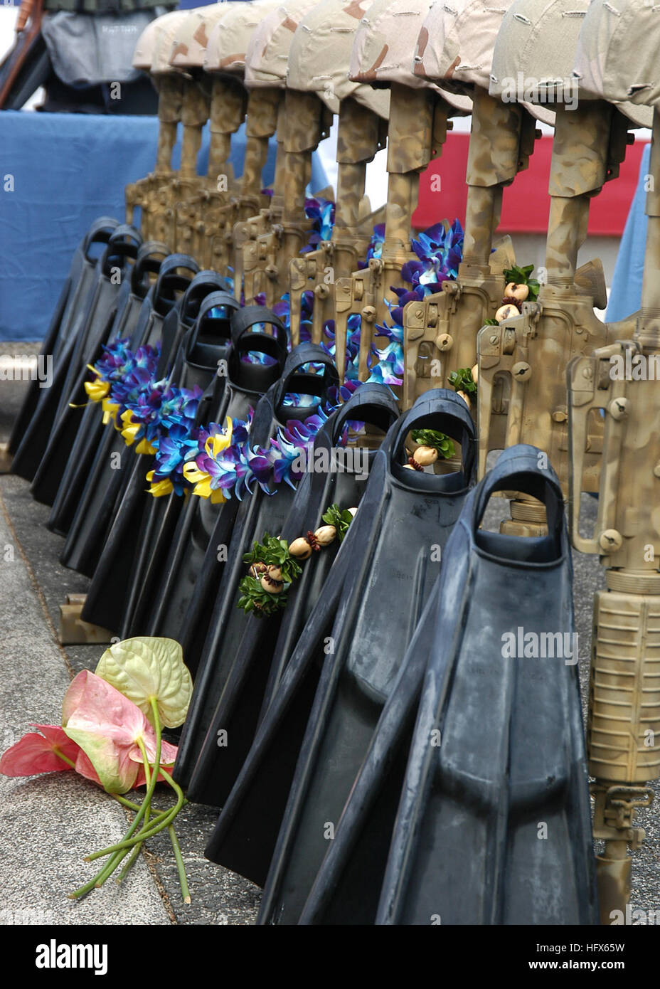US Navy A flower rests in front of a ceremonial formation of U.S. Navy SEAL  equipment during a memorial service for five Sailors assigned to SEAL  Delivery Vehicle Team One (SDVT-1 Stock