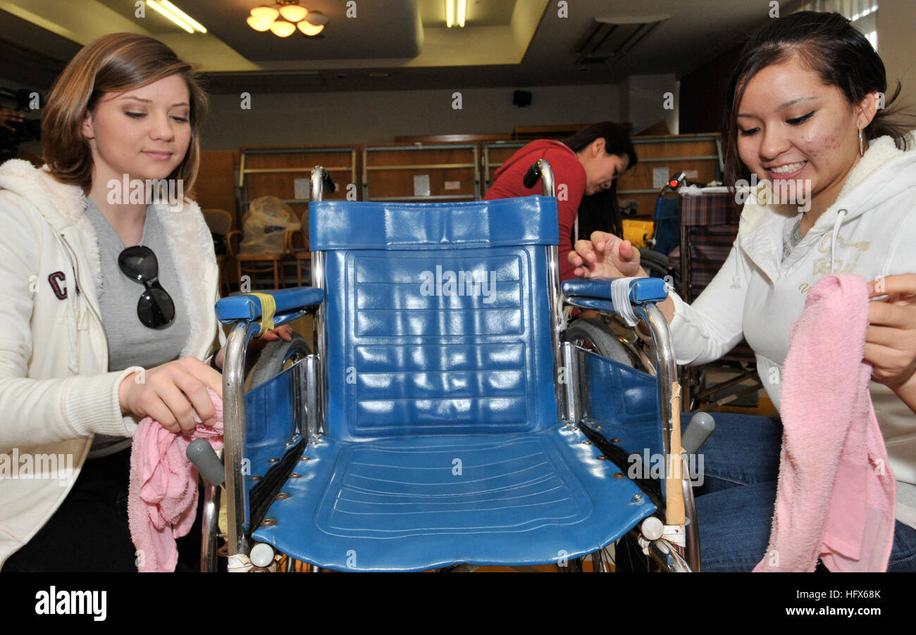 090304-N-2638R-003 YOKOSUKA, Japan (March 4, 2009) Personnel Specialist Seaman Recruit Sherrie Downing from Dothan, Ala., left, and Personnel Specialist Seaman Gabriela Moreno, from San Antonio, clean a wheelchair at YokosukaÕs Aiko-En Retirement Home. More than 30 Sailors from various commands at Fleet Activities Yokosuka visited the home for a community relations event where they cleaned wheelchairs, vehicles and rooms throughout the facility. (U.S. Navy photo by Mass Communication Specialist Bryan Reckard/Released) US Navy 090304-N-2638R-003 Personnel Specialist Seaman Recruit Sherrie Downi Stock Photo