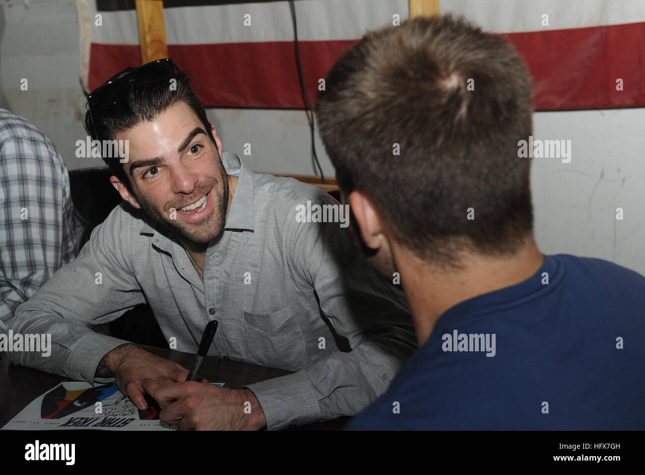 Zachary Quinto (left) and Chris Pine joke around while signing autographs for military personnel on a base in the Middle East on April 11. Zachary and Chris are part of the new Star Trek movie who were visiting the bases in the area for the movie premier. Zachary Quinto 1 Stock Photo