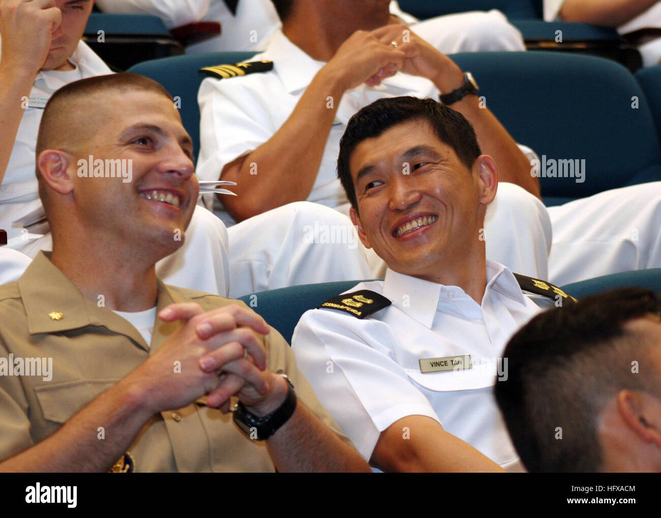 090608-N-8467B-027 SINGAPORE (June 8, 2009) Maj. Derek Snell, landing force officer-in-charge for Cooperation Afloat Readiness and Training (CARAT) 2009, visits with Lt. Col. Vince Tan, executive officer of the Republic of Singapore Navy frigate RSS Intrepid, before the opening ceremony for the Singapore phase of CARAT at Changi Naval Base. CARAT is a series of bilateral exercises held annually in Southeast Asia to strengthen relationships and enhance the operational readiness of the participating forces. (U.S. Navy photo by Mass Communications Specialist 2nd Class Ernesto Bonilla/Released) US Stock Photo