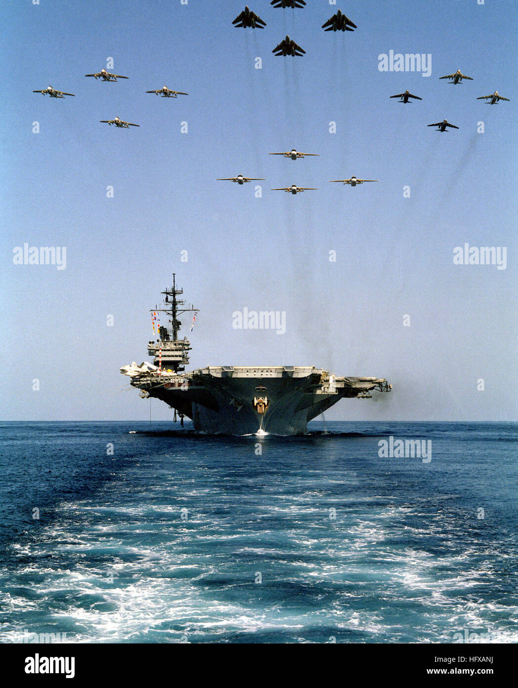A bow view of the aircraft carrier USS AMERICA (CV-66) underway as16  aircraft from Carrier Air Wing One (CVW-1) fly overhead. USS America (CV-66)  and air wing 1 Stock Photo - Alamy