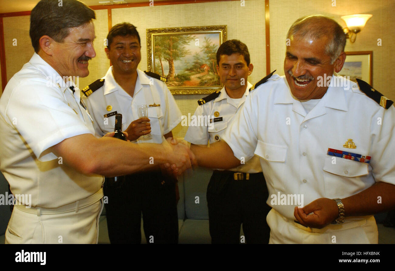 Rodman, Pamana (Aug. 5, 2005) - Master Chief Petty Officer of the Navy Terry D. Scott, left, shares a light moment Command Master Chief Carlos Arayor, right, of the Chilean Fast Frigate Almirante Williams (FF 19). Master Chief Scott visited with Chilean Chief Petty Officers and stressed the importance of the two nations working together.  Master Chief Scott was in Panama, where the Williams is moored next to the USS Thomas S. Gates (CG 51), to visit with sailors taking part in PANAMAX 05. PANAMAX is an exercise to develop a multinational response to threats against the Panama Canal.  This year Stock Photo