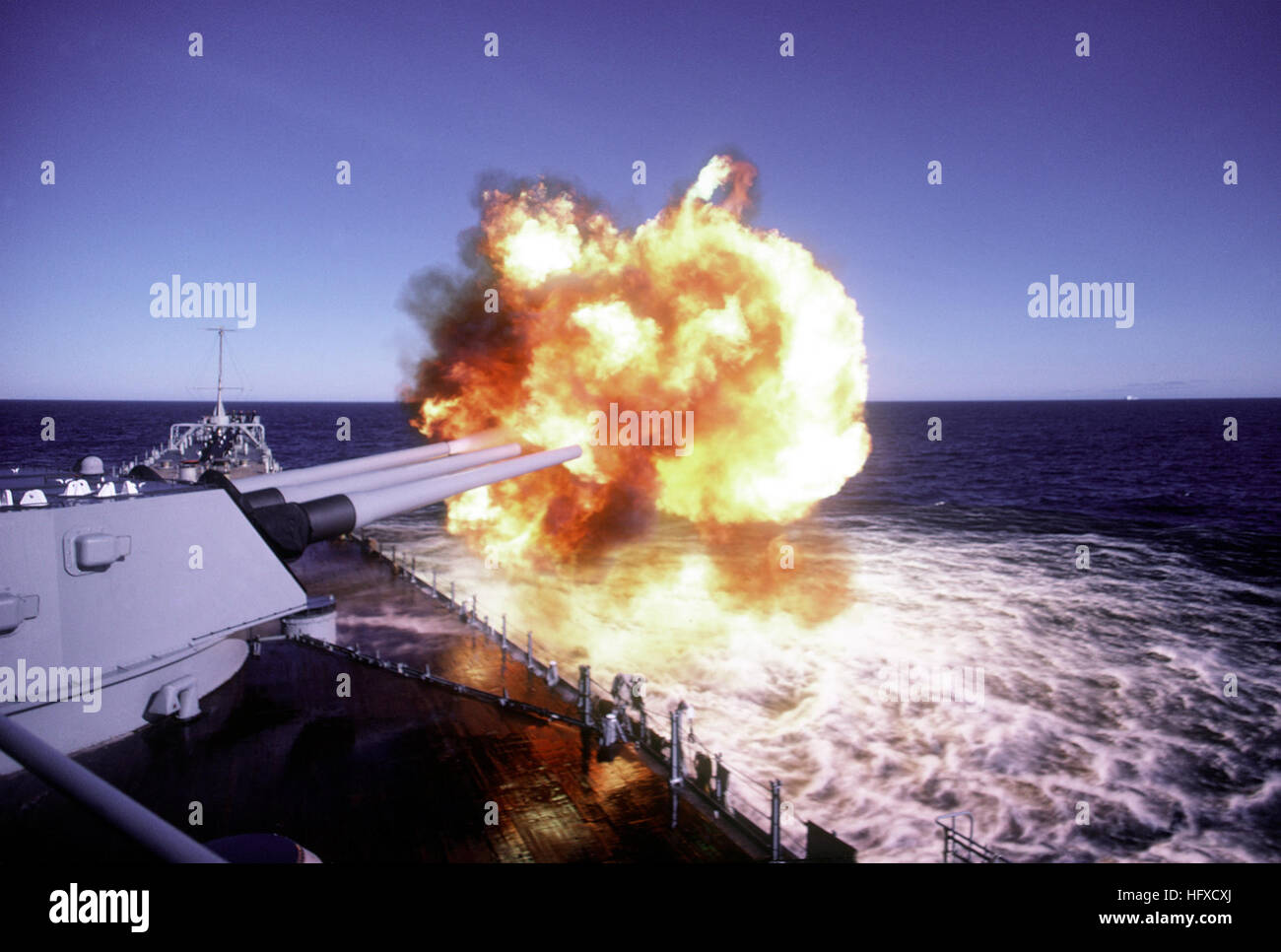 The No. 1 turret Mark 7 16-inch/50-caliber guns are fired aboard the battleship USS IOWA (BB-61) during exercise Ocean Safari '85. USS Iowa BB-61 - Ocean Safari 85 - DN-ST-87-02388 Stock Photo