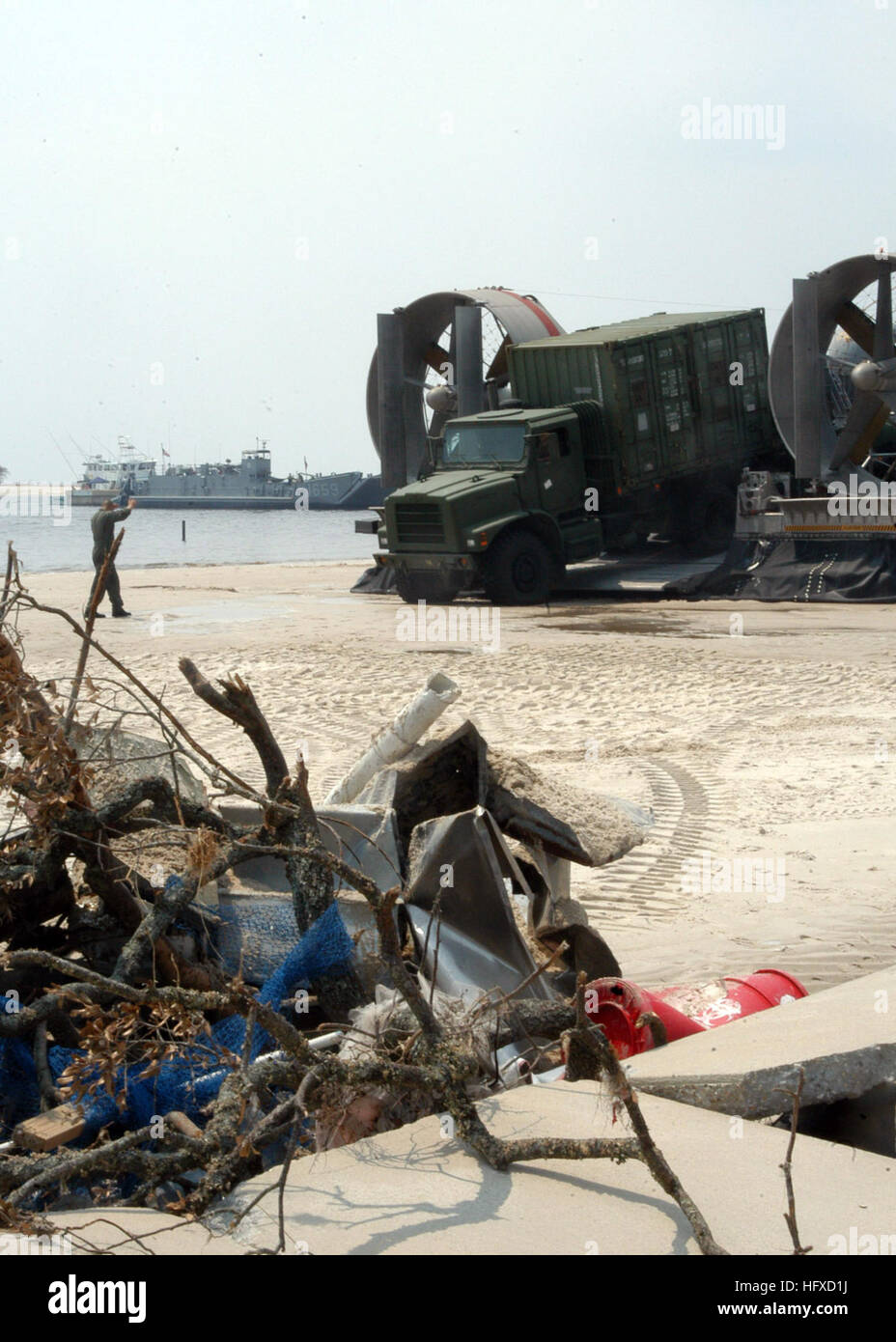 050904-N-7638K-021 Biloxi, Miss. (Sept. 4, 2005) Ð Heavy equipment from the Amphibious Construction Battalion Two (ACB-2) arrives on the shores of Biloxi, Miss., to render assistance to Hurricane Katrina survivors. The equipment was transported via Landing Craft, Air Cushion (LCAC) from the amphibious assault ship USS Iwo Jima (LHD 7). The Navy's involvement in the Hurricane Katrina humanitarian assistance operations is led by the Federal Emergency Management Agency (FEMA), in conjunction with the Department of Defense. U.S. Navy photo by Lithographer 1st Class Edward S. Kessler (RELEASED) US  Stock Photo