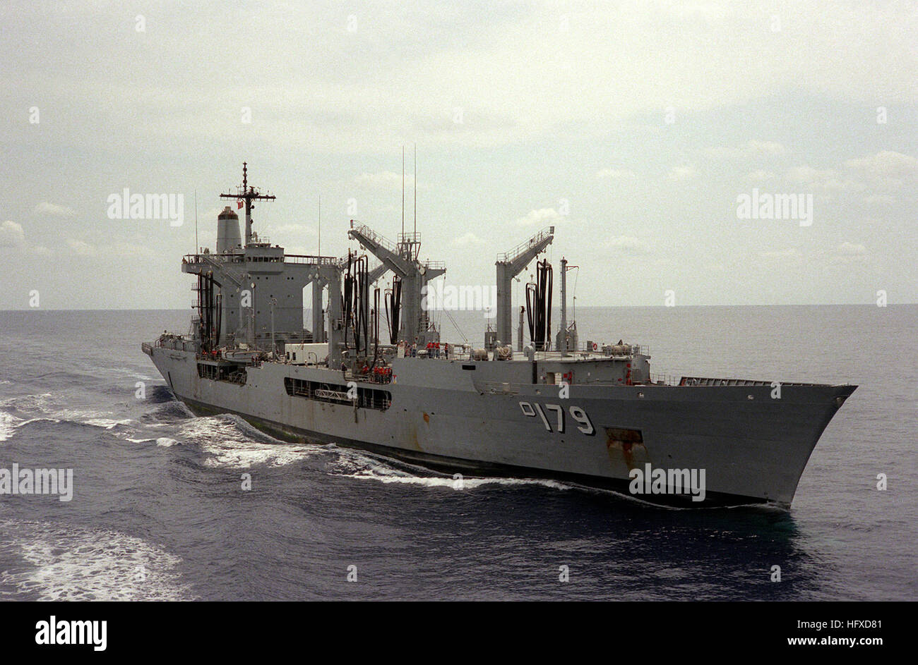 A starboard bow view of replenishment oiler USS MERRIMACK (AO-179) underway off the Virginia Capes. USS Merrimack (AO-179) off Virginia Capes 1985 Stock Photo