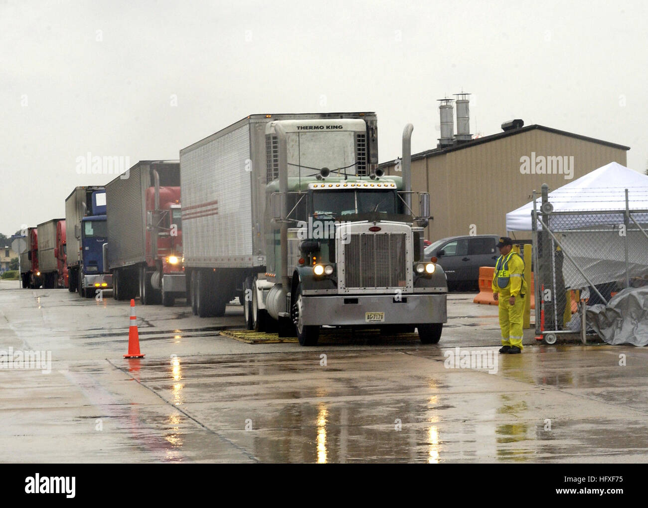 051024-N-1126D-002  Jacksonville, Fla. (Oct. 24,2005) - Trucks carrying relief supplies enter the Federal Emergency Management Agency (FEMA) staging area on board Naval Air Station Jacksonville, Fla. The relief supplies will be distributed to victims of Hurricane Wilma. U.S. Navy photo by Photographer's Mate 3rd Class Clarck Desire (RELEASED) US Navy 051024-N-1126D-002 Trucks carrying relief supplies enter the Federal Emergency Management Agency (FEMA) staging area on board Naval Air Station Jacksonville, Fla Stock Photo