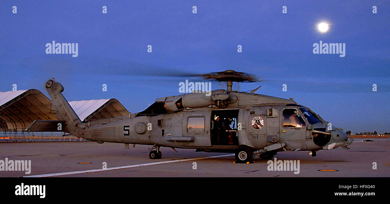 051114-N-9500T-046 El Centro, Calif. (Nov. 14, 2005) - An HH-60H Seahawk helicopter, assigned to the ÒEightballersÓ of Helicopter Anti-Submarine Squadron Eight (HS-8), prepares to takeoff for a night training mission from Naval Air Facility (NAF) El Centro, Calif. A detachment from HS-8 is currently deployed to NAF El Centro to conduct periodic Combat Search and Rescue (CSAR) and weapons training. U.S. Navy photo by PhotographerÕs Mate 2nd Class Scott Taylor (RELEASED) US Navy 051114-N-9500T-046 An HH-60H Seahawk helicopter prepares to takeoff for a night training mission from Naval Air Facili Stock Photo