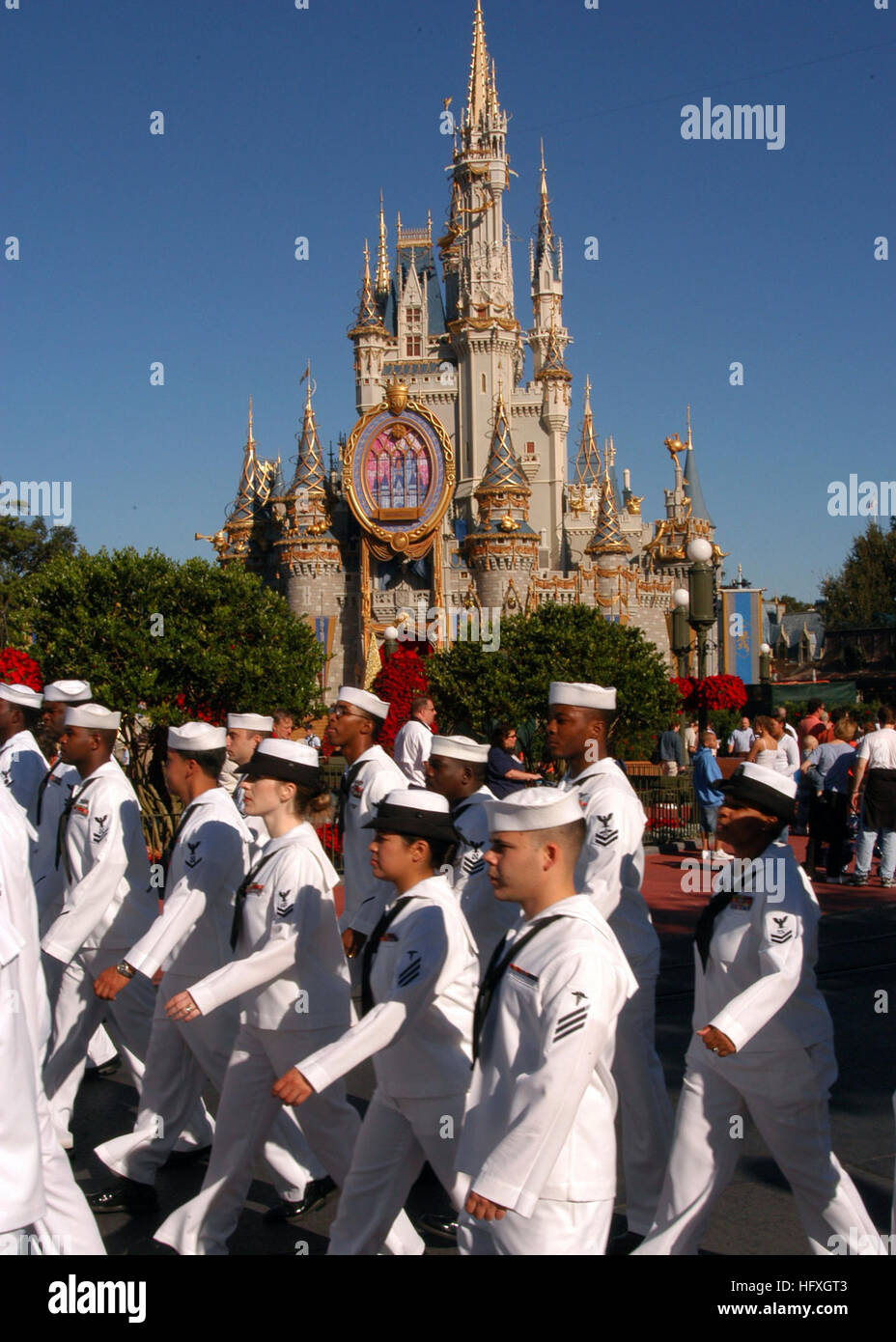 051204-N-6645H-076 Orlando, Fla. (Dec. 4, 2005) - Sailors from various U.S. Navy commands throughout Navy's Southeast Region march before Cinderella's Castle before entering onto Main St. inside Walt Disney World's Magic Kingdom. The Sailors were greeted by family members and guests and joined Disney World's Military Salute for its 2005 Christmas Day Parade taping. U.S. Navy photo by PhotographerÕs Mate 3rd Class Adam J. Herrada (RELEASED) US Navy 051204-N-6645H-076 Sailors from various U.S. Navy commands throughout Navy's Southeast Region march before Cinderella's Castle before entering onto  Stock Photo