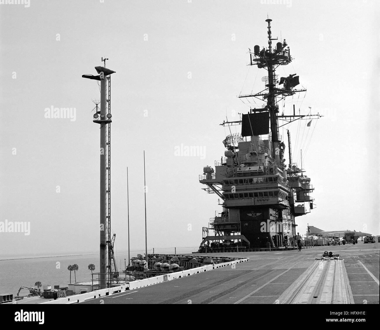 The "Belknap" pole antenna dominates a view of the foredeck and island