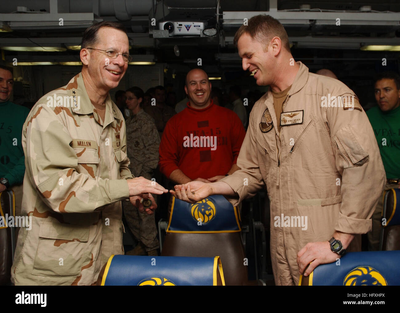 060104-N-7241L-012 January 4, 2006 Persian Gulf Aboard Theodore Roosevelt (CVN71) Chief of Naval Operations Admiral Mike Mullen talks with members of the 'Valions' of Strike Fighter Squadron One Five (VFA-15) during a visit to USS Theodore Roosevelt (CVN 71). The nuclear powered aircraft carrier is currently underway on a regularly scheduled deployment supporting maritime security operations. U.S. Navy photo by Photographer's Mate Airman Apprentice Nathan Laird US Navy 060104-N-7241L-012 Chief of Naval Operations (CNO), Adm. Mike Mullen, talks with air crew assigned to the Valions of Strike Fi Stock Photo