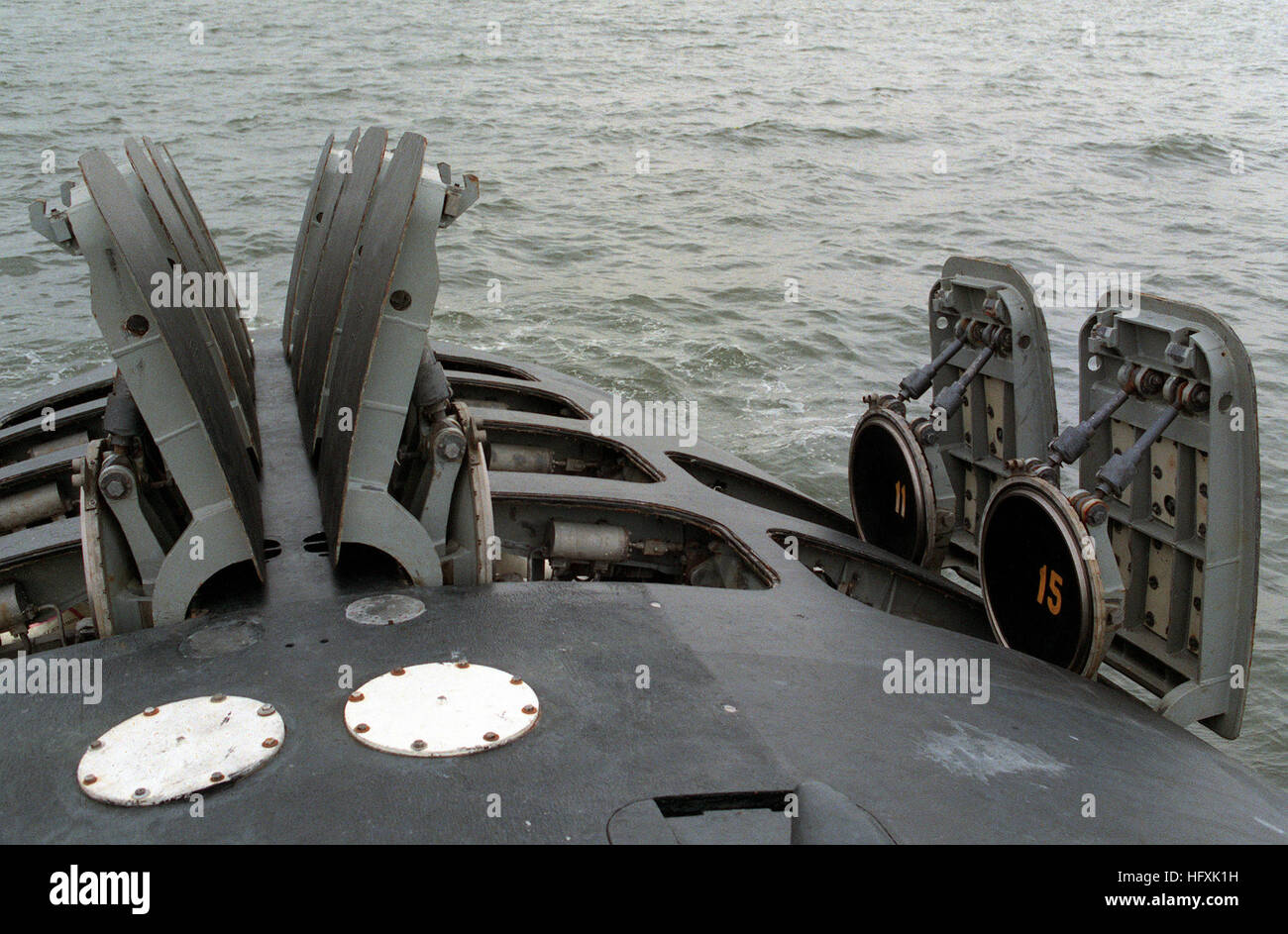 The hatches of the 12 vertical-launch Tomahawk missile tubes stand open on the bow of the nuclear-powered attack submarine USS OKLAHOMA CITY (SSN-723). VLS on board Oklahoma City (SSN-723) Stock Photo