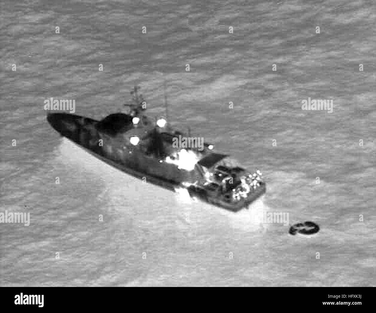 060204-N-0000N-001   RED SEA (Feb 4, 2006) - Infrared imagery taken from a U.S. Navy P-3C Orion maritime patrol aircraft, assisting in search and rescue operations for survivors of the Egyptian ferry Al Salam Boccaccio 98 in the Red Sea, shows a rescue vessel alongside a life raft.  The aircraft, assigned to the Golden Swordsmen of Patrol Squadron (VP-47), flew for almost 15 hours during the mission to assist local authorities in the search efforts.  VP-47 is homeported at Marine Corps Base Hawaii, Kaneohe Bay, and is currently supporting missions in the U.S. Central Command (USCENTCOM) area o Stock Photo