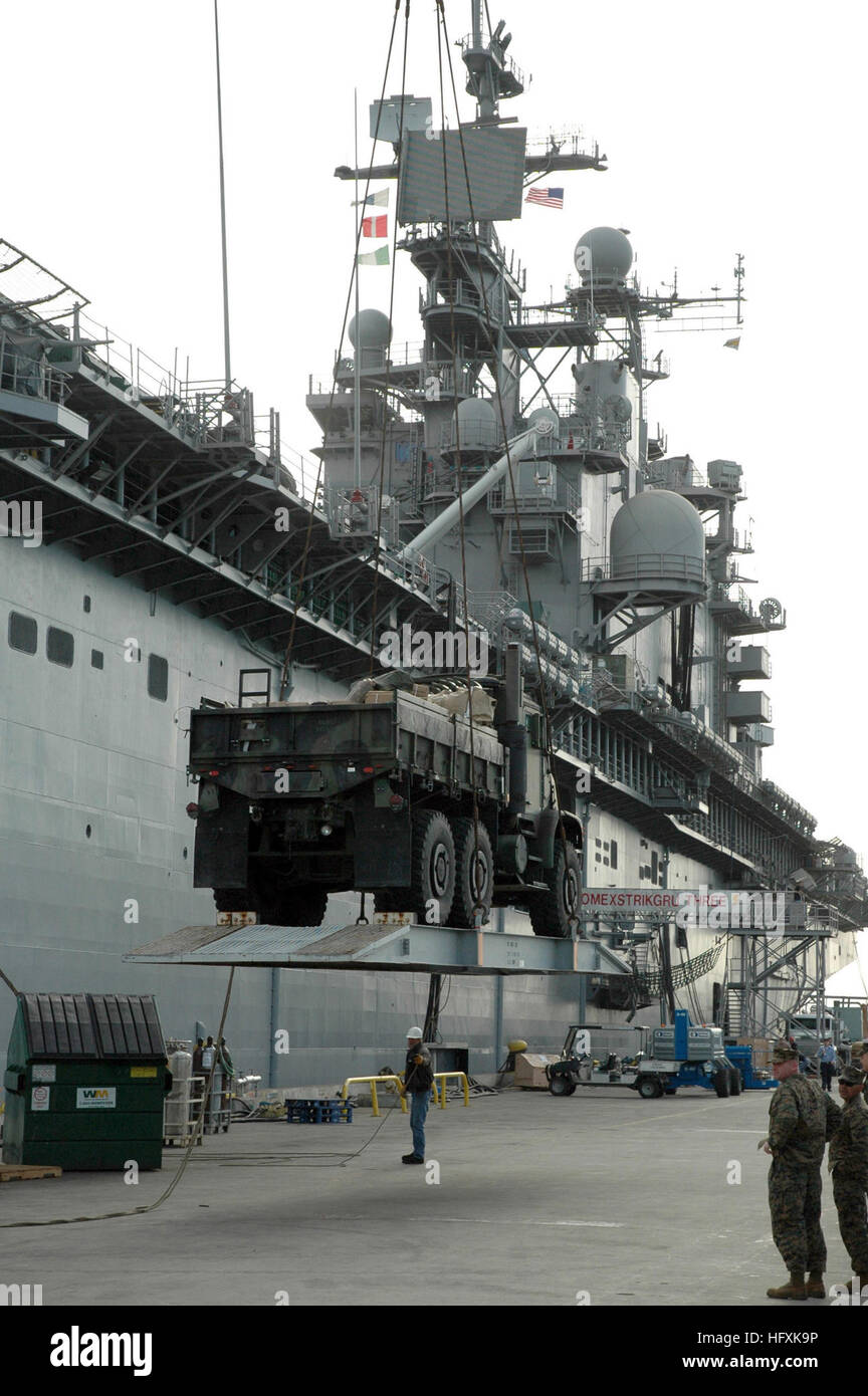060208-N-5764B-005 San Diego (Feb. 9, 2006) - Combat Cargo Marines use a crane to load equipment onto the amphibious assault ship USS Peleliu (LHA 5) for a scheduled deployment in support of the global war on terrorism. U.S. Navy photo by Lithographer 1st Class John Banfield (RELEASED) US Navy 060208-N-5764B-005 Combat Cargo Marines use a crane to load equipment onto the amphibious assault ship USS Peleliu (LHA 5) for a scheduled deployment in support of the global war on terrorism Stock Photo