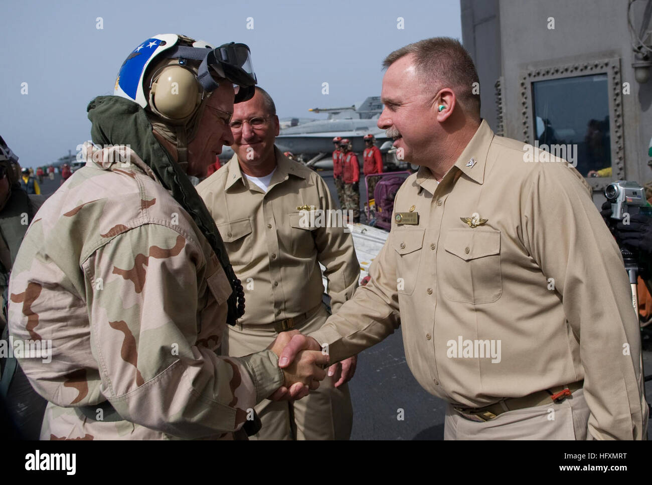 090713-N-0696M-064  GULF OF OMAN (July 13, 2009) Adm. Mike Mullen, left, chairman of the Joint Chiefs of Staff, is greeted by Capt. Kenneth Norton, commanding officer of the aircraft carrier USS Ronald Reagan (CVN 76) in the Gulf of Oman. Mullen is accompanying a USO tour featuring Hall of Fame NFL coach Don Shula, All-Pro NFL running back Warrick Dunn, actors Bradley Cooper and D.B. Cooper and sports announcer and model Leeann Sweeden on a visit to the Central Command area of responsibility. (U.S. Navy photo by Mass Communication Specialist 1st Class Chad J. McNeeley/Released) US Navy 090713- Stock Photo