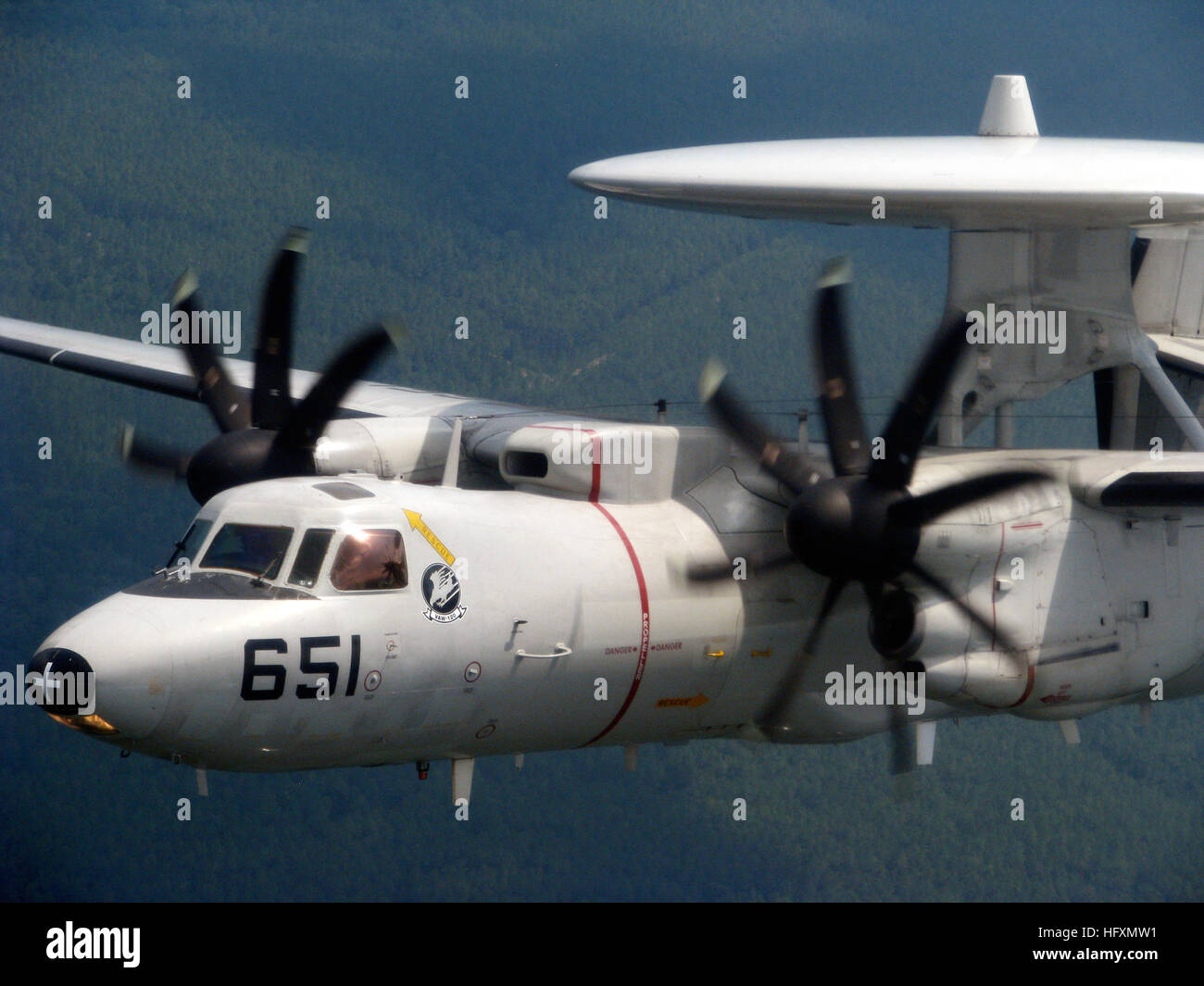 An E-2C Hawkeye from Carrier Airborne Early Warning Squadron 120 flies ...