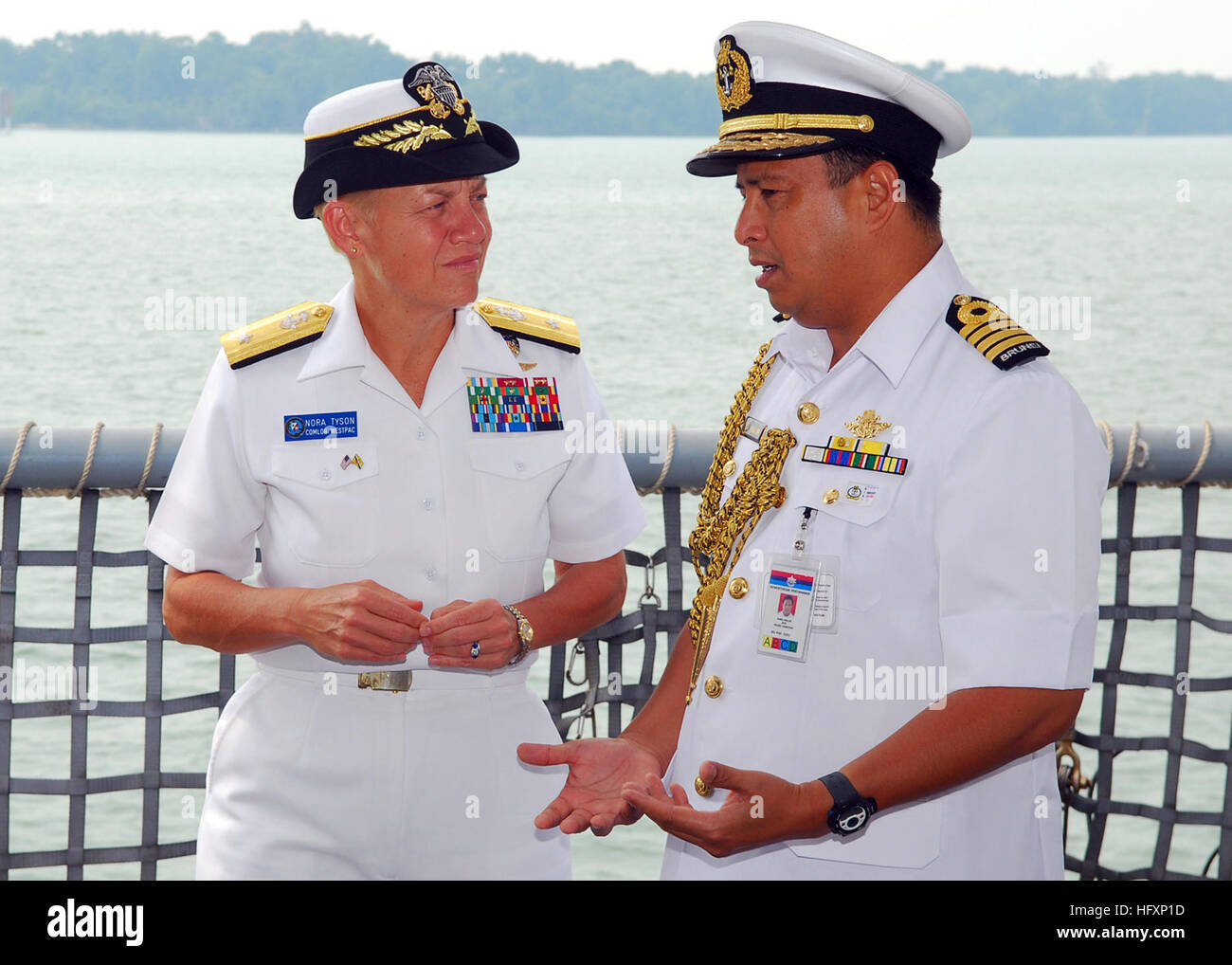 090804-N-5207L-040  MUARA, Brunei (Aug. 4, 2009) Rear Adm. Nora Tyson, commander of Logistics Group Western Pacific, listens to Col. Haji Abdul Halim bin Haji Mohd Hanifah, commander of the Royal Brunei Navy, before the opening ceremony for Cooperation Afloat Readiness and Training (CARAT) Brunei 2009. CARAT is a series of bilateral exercises held annually in Southeast Asia to strengthen relationships and enhance the operational readiness of the participating forces. (U.S. Navy photo by Mass Communication Specialist 1st Class Bill Larned/Released) US Navy 090804-N-5207L-040 Rear Adm. Nora Tyso Stock Photo