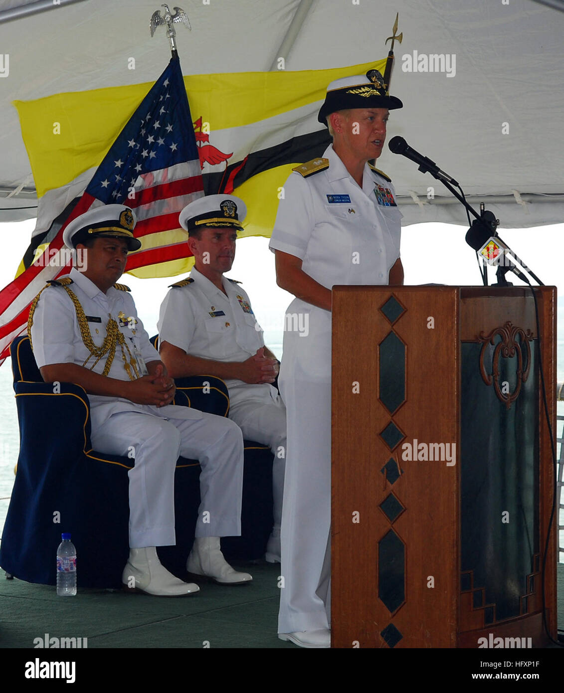 090804-N-5207L-064  MUARA, Brunei (Aug. 4, 2009) Rear Adm. Nora Tyson, commander of Logistics Group Western Pacific, speaks at the opening ceremony for Cooperation Afloat Readiness and Training (CARAT) Brunei 2009.  Col. Haji Abdul Halim bin Haji Mohd Hanifah, left, commander, Royal Brunei Navy, and Capt. William Kearns III, commander of Task Group 73.5. CARAT is a series of bilateral exercises held annually in Southeast Asia to strengthen relationships and enhance the operational readiness of the participating forces. (U.S. Navy photo by Mass Communication Specialist 1st Class Bill Larned/Rel Stock Photo